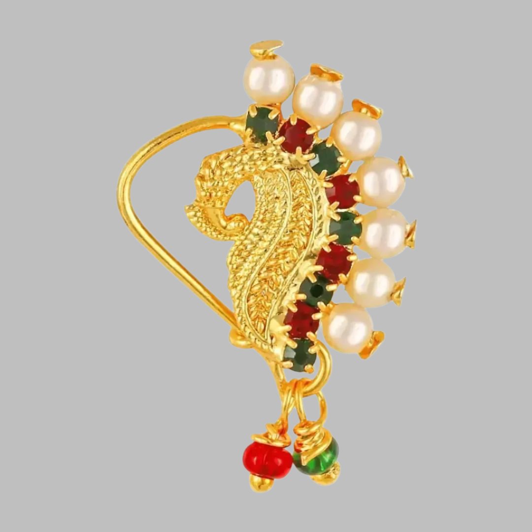 Traditional Gold Plated Tar Nose Ring Nathani Nath with Pearl CS. Traditional Wearing Gold Plated,Pearl With CZ,Tar Nose Ring (Tar)
Color:  Golden
Ethenic : Nath, Nathani , Tar, Nose ring
Style:  Pearls Studded
Material:  Alloy
Stone Type:  American Diamond
Length: 3.0 (in cm)
How to Wear - This is a clip on nath to put on left nostril of the nose. Just clip on the nose stud on left nostril and press the back side of nath nose ring and it will hook onto the nose.